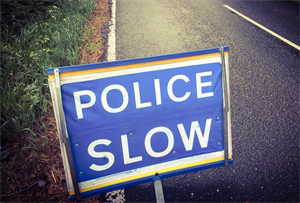 Police slow sign
