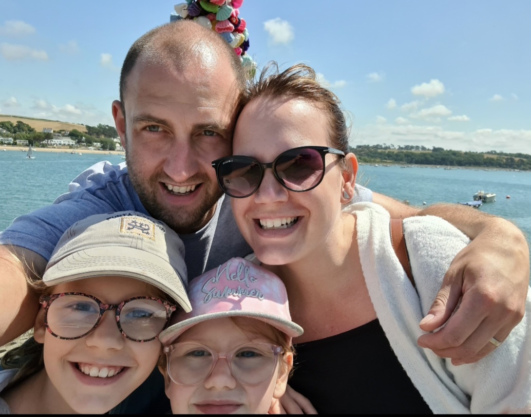 Four people smiling at camera