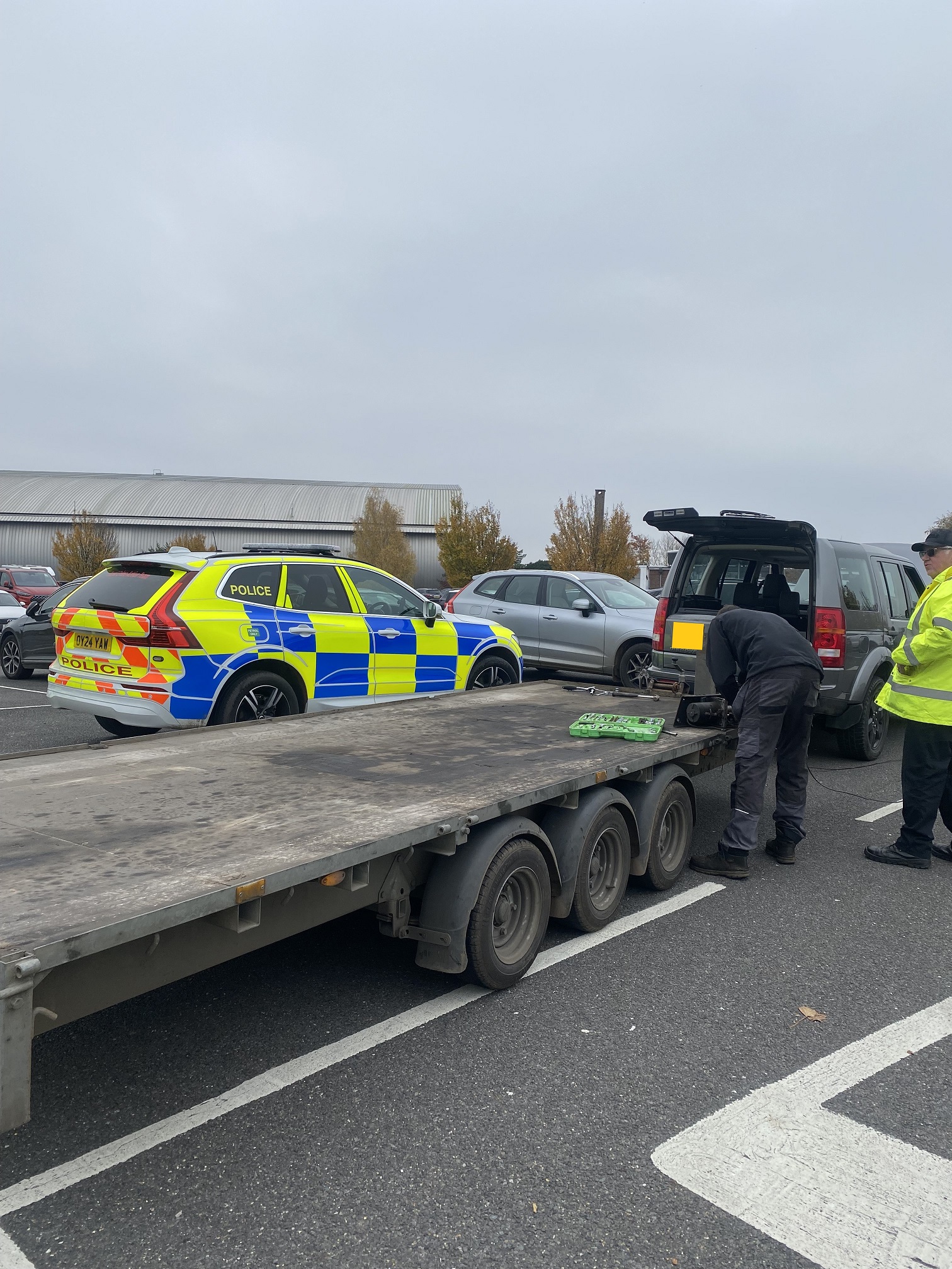 Stolen trailer with police vehicles