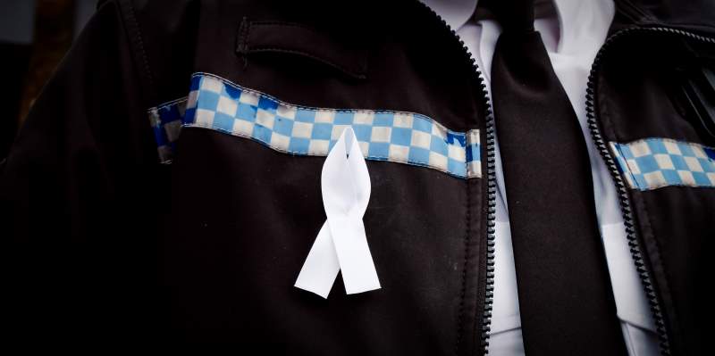 Officer wearing a white ribbon 