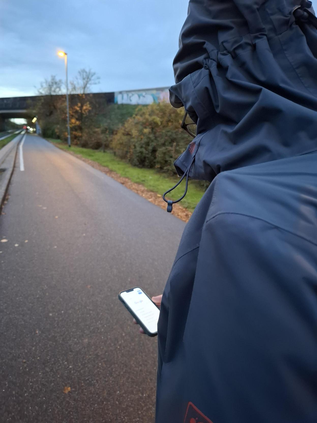 image of man holding his phone