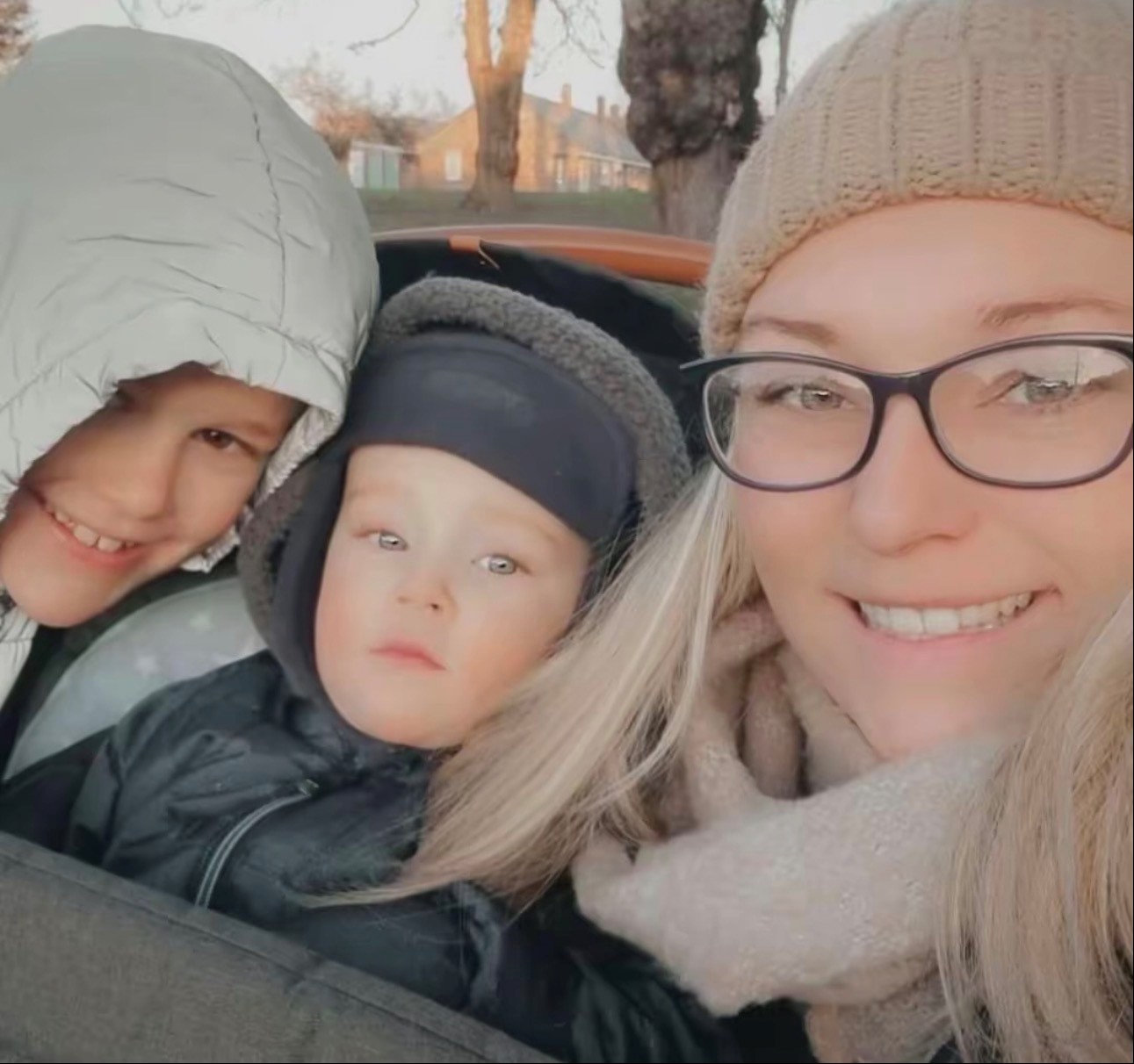 A photo of a woman with two children. 