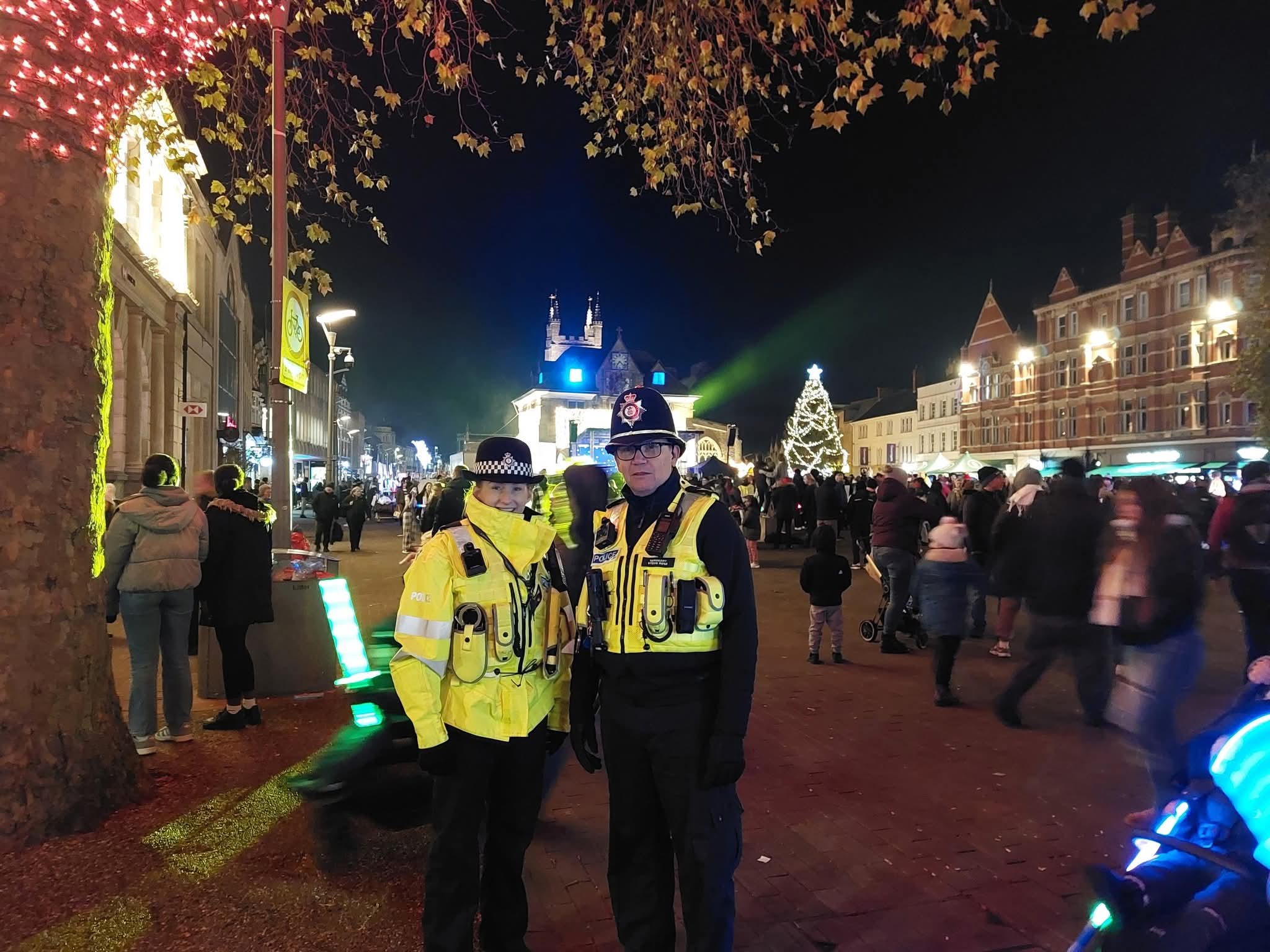 Two police officers in Cathedral Square in Peterborough at night