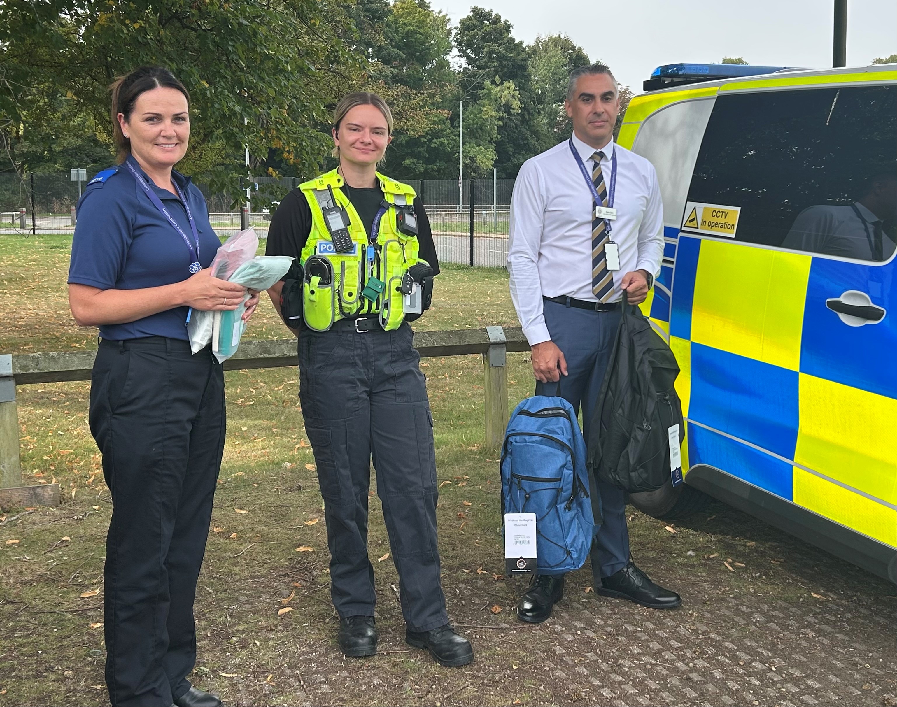 Putting bags in a police vehicle 