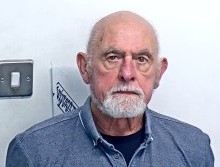 A custody photo of an ageing man. 