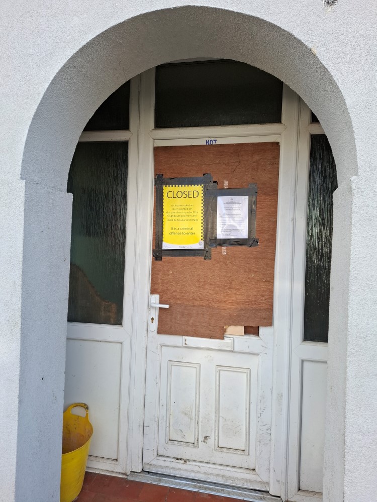 Closure order signs on the front of a door