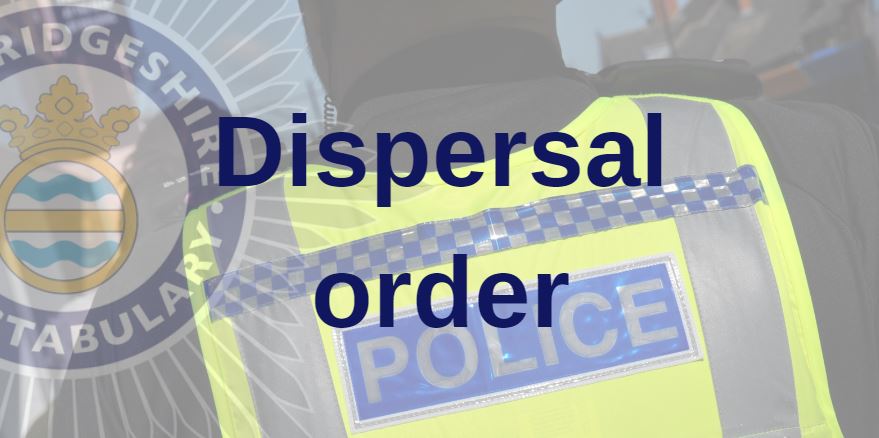 Close up of the back of a police officer's high-vis vest with dispersal order text overlaid