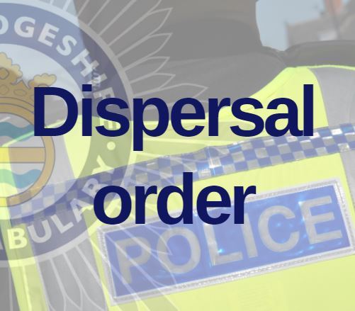 Close up of back of a police high-viz vest with dispersal order text overlaid
