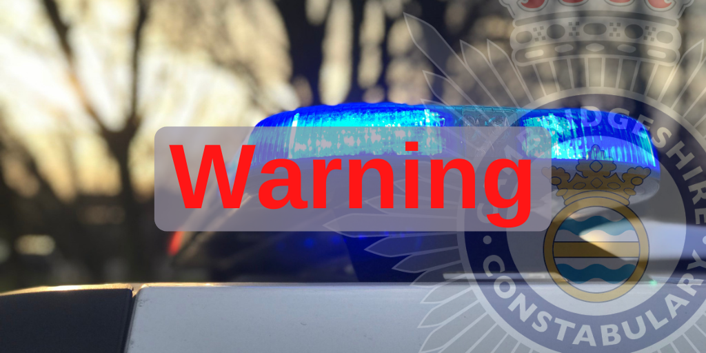Close up of a police cars blue lights with red warning text overlaid