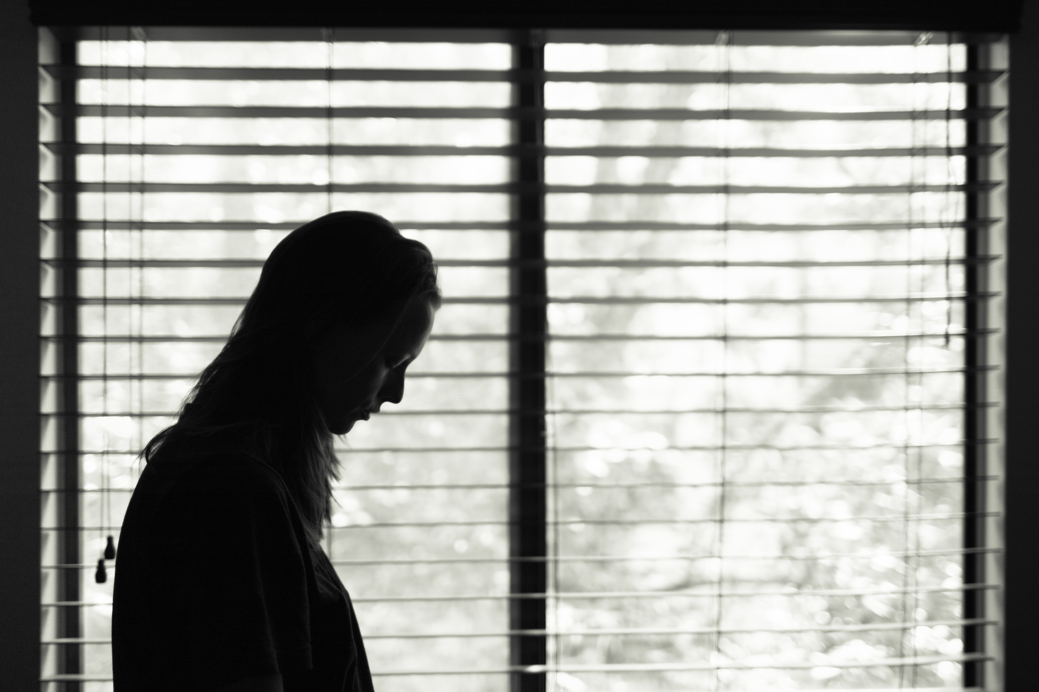 Woman next to window
